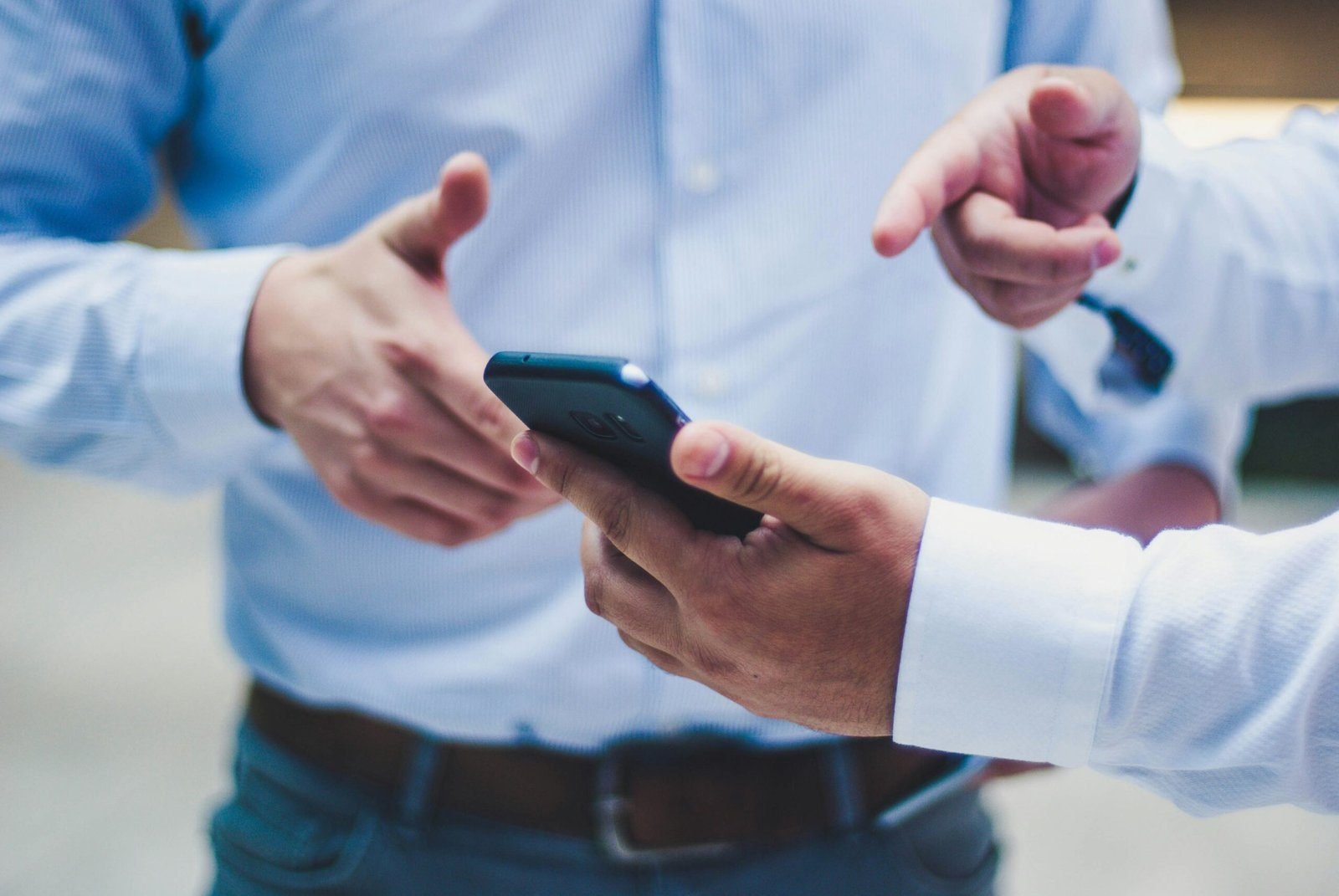 Business meeting with smartphone